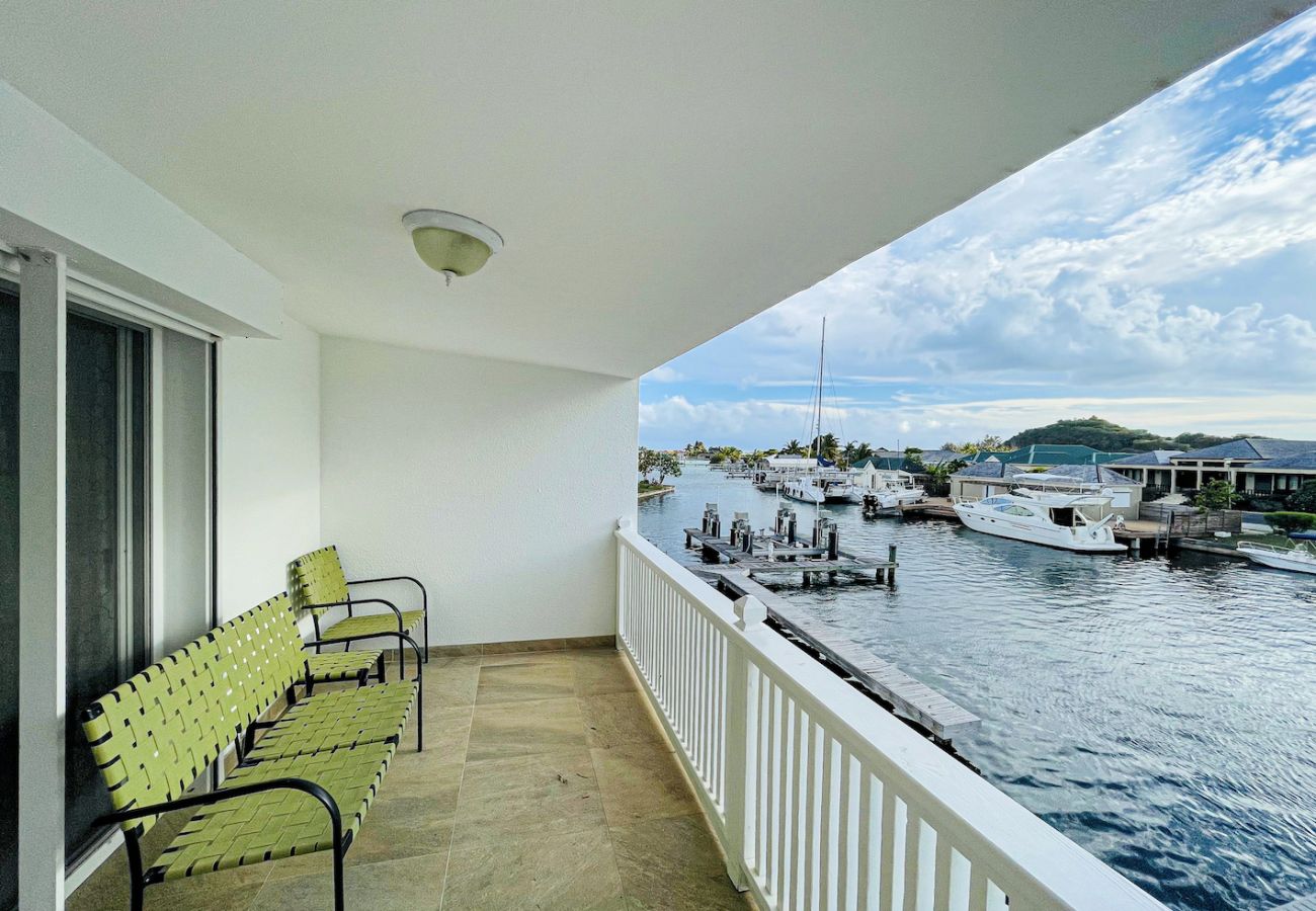 Jolly Harbour villa rentals, Master bedroom, private balcony with views of the waterway at Jolly Harbour villa rentals 