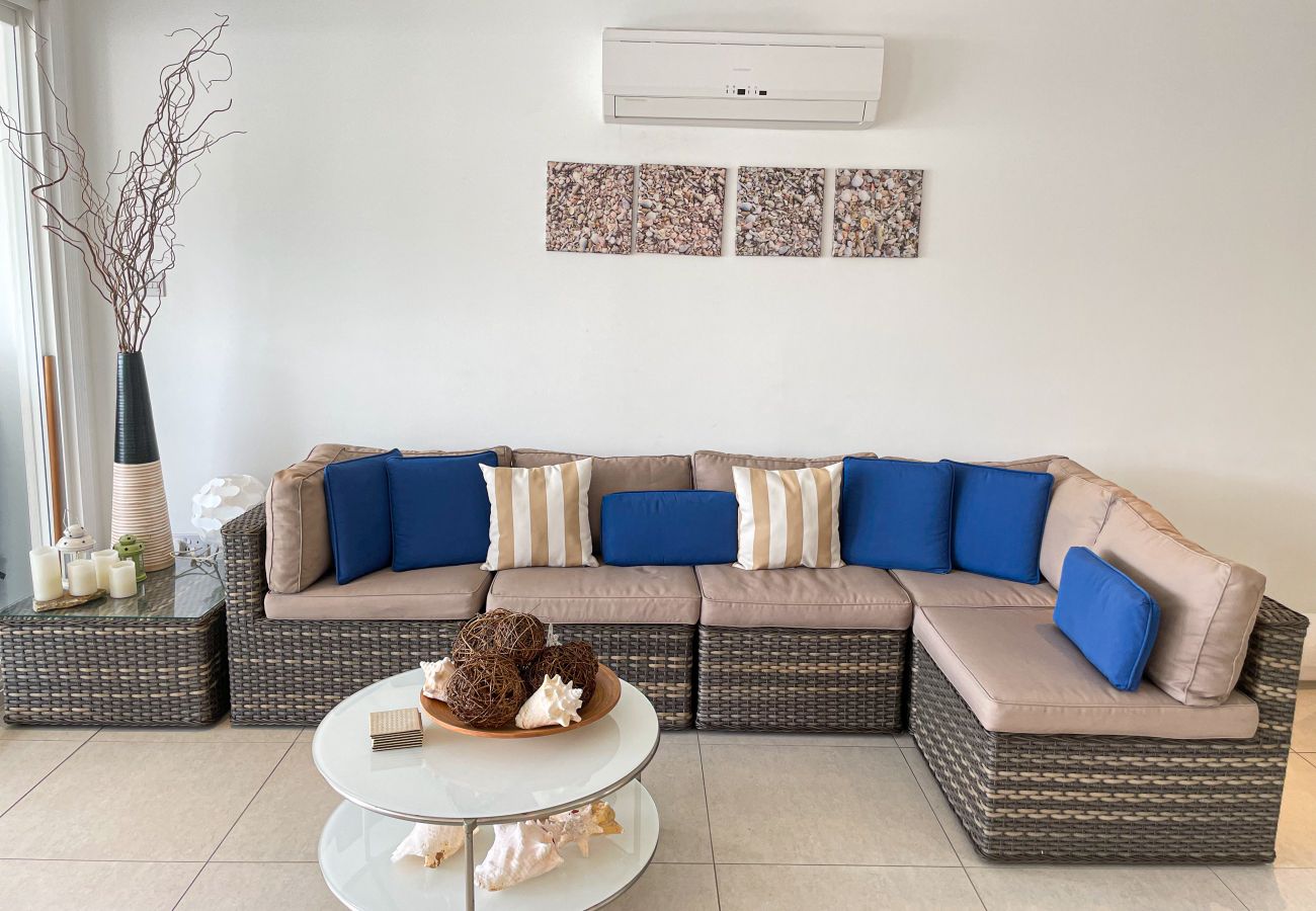 Jolly Harbour holiday home rentals, comfortable living room, extended deck with sunset views
