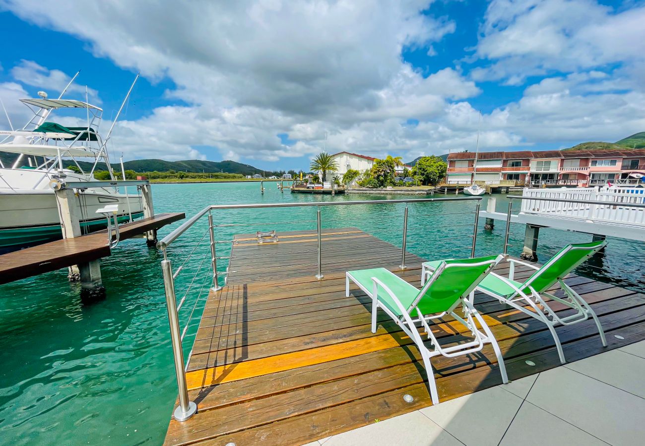 Al fresco dining, Large deck, Sun loungers, sunset views at Jolly Harbour villa rentals, Antigua