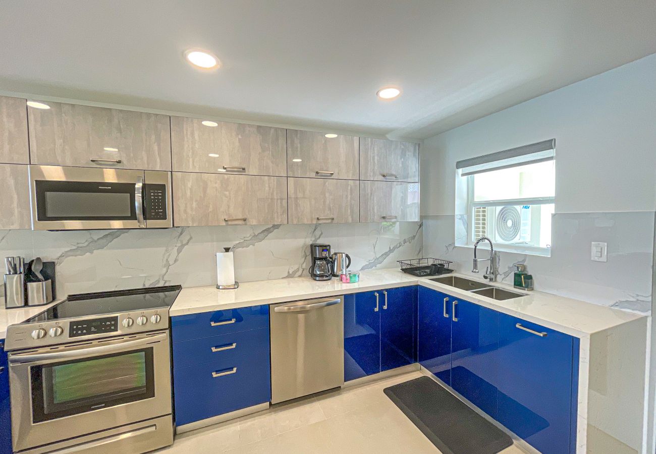 Amazing waterfront view, fully equipped open plan kitchen at Jolly Harbour Villa Rentals,Antigua