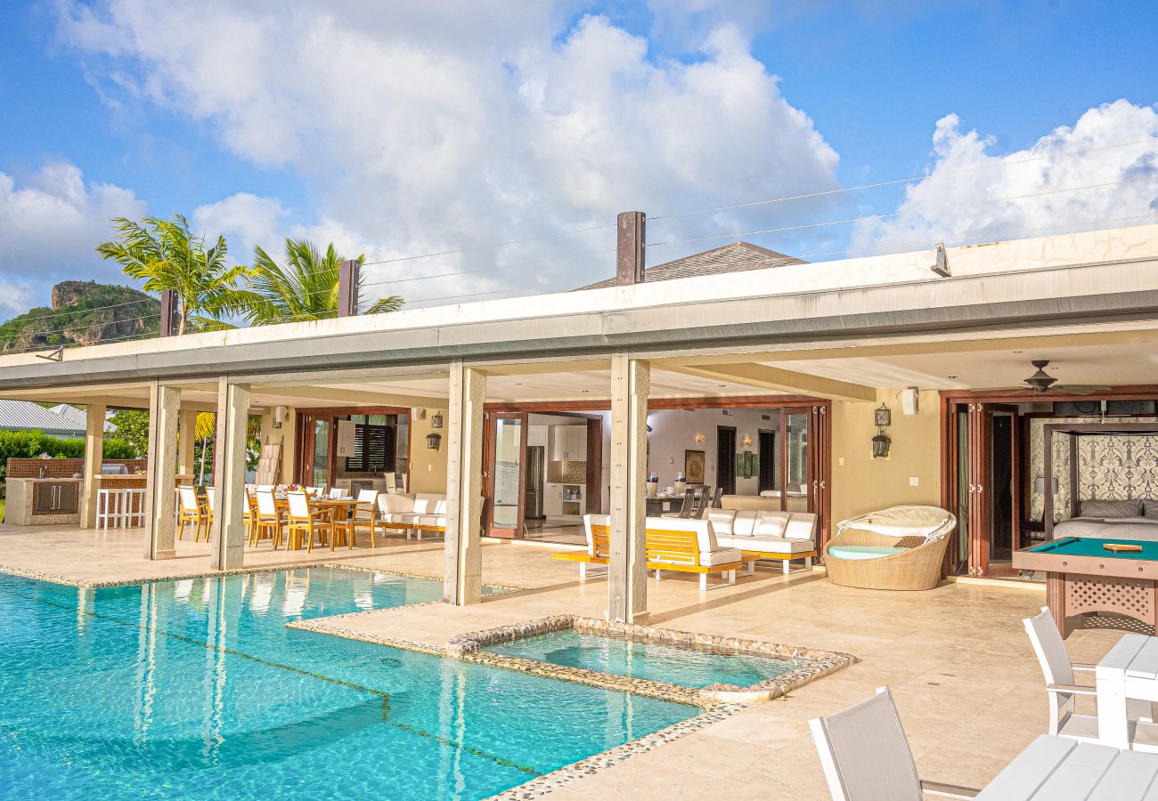 Heated sitting pool, full barbeque suite and breathtaking views of the Caribbean Sea at Jolly Harbour Villa Rentals