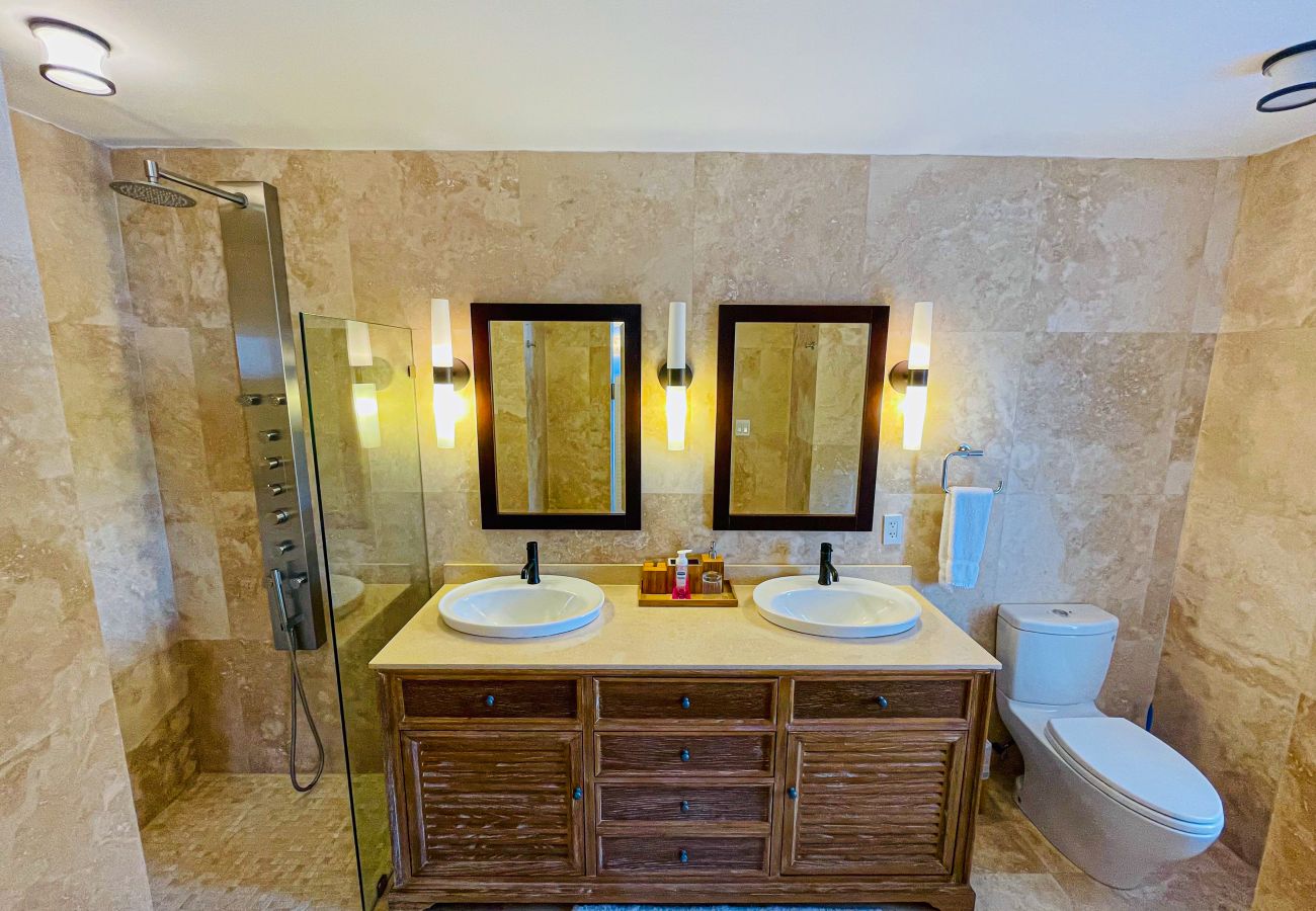 Luxurious en-suite bathrooms laid with full body showers with double sinks at Sugar Ridge Villa Rentals