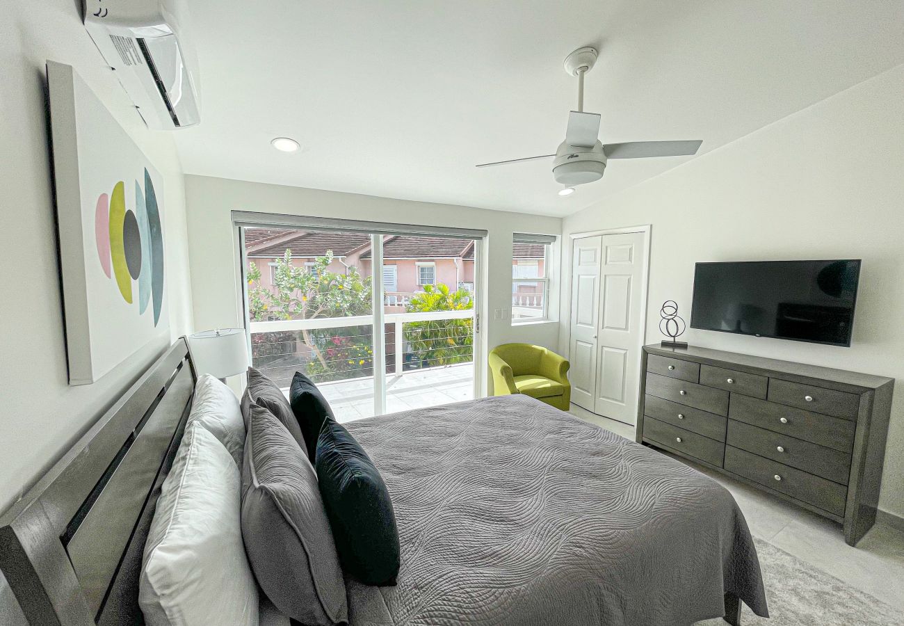 Spacious one bedroom with queen sized bed, adequate closet space and a private balcony at Jolly Harbour