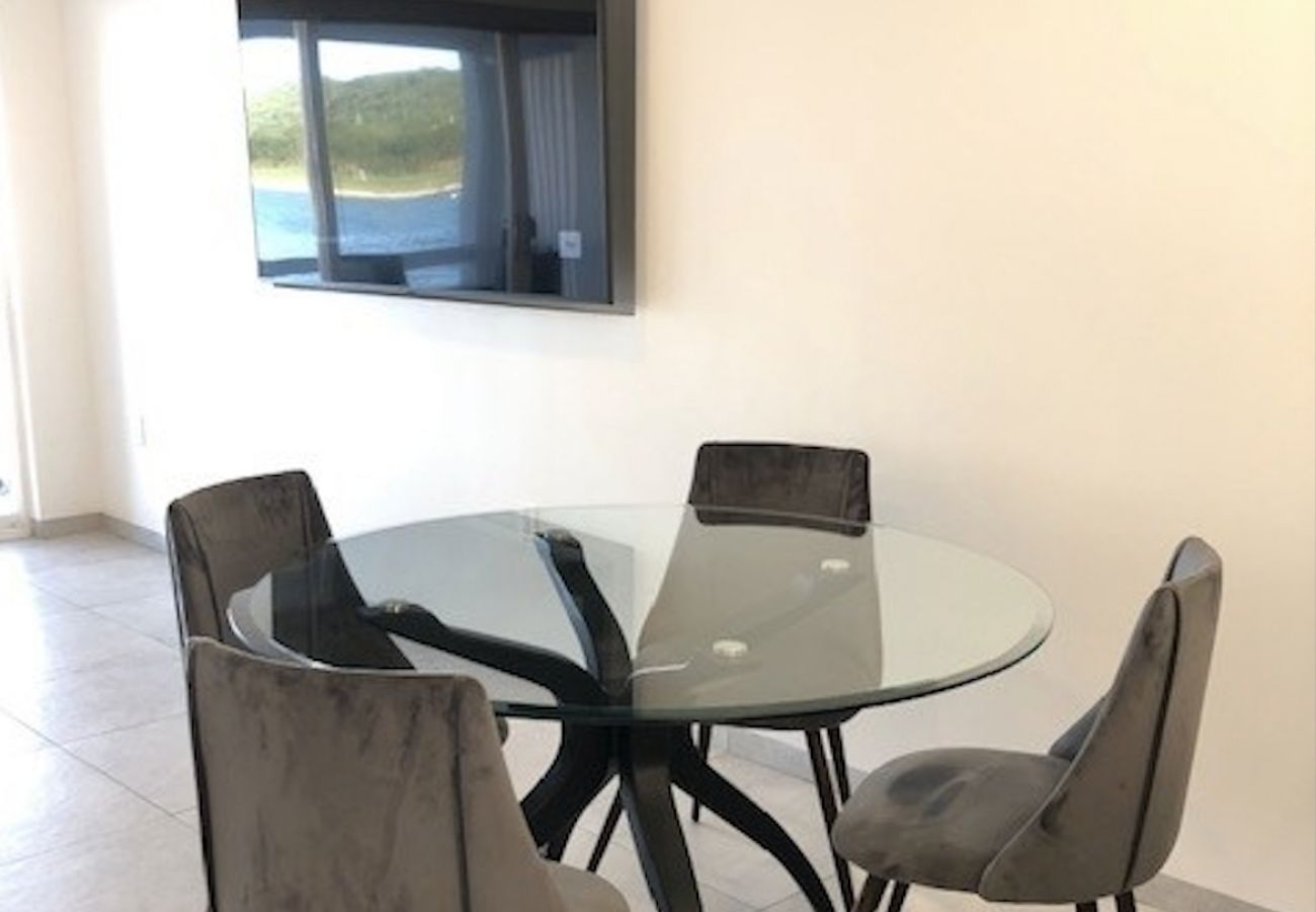 Townhouse in Jolly Harbour - Modern Waterfront Paradise 