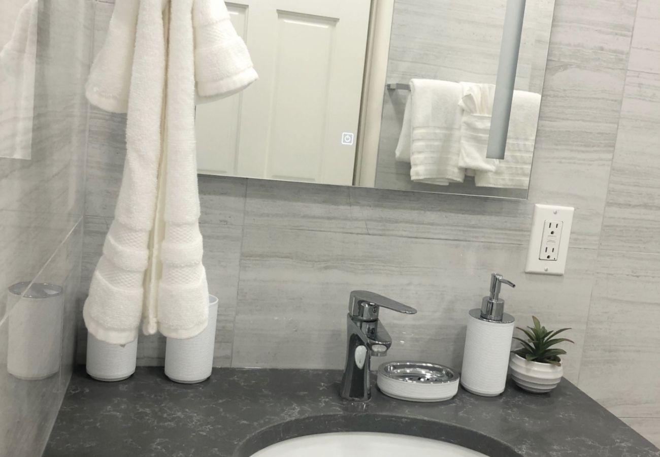 Lovely One Bedroom Apartment, fitted with a sink, mirror, and large shower at Jolly Harbour Villa rentals
