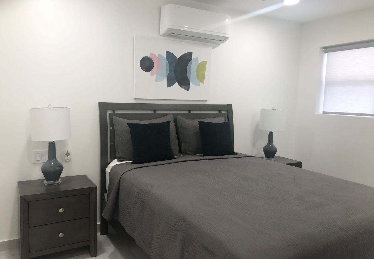 Lovely modern one bedroom with queen sized bed, adequate closet space, air conditioning, and ceiling fan 