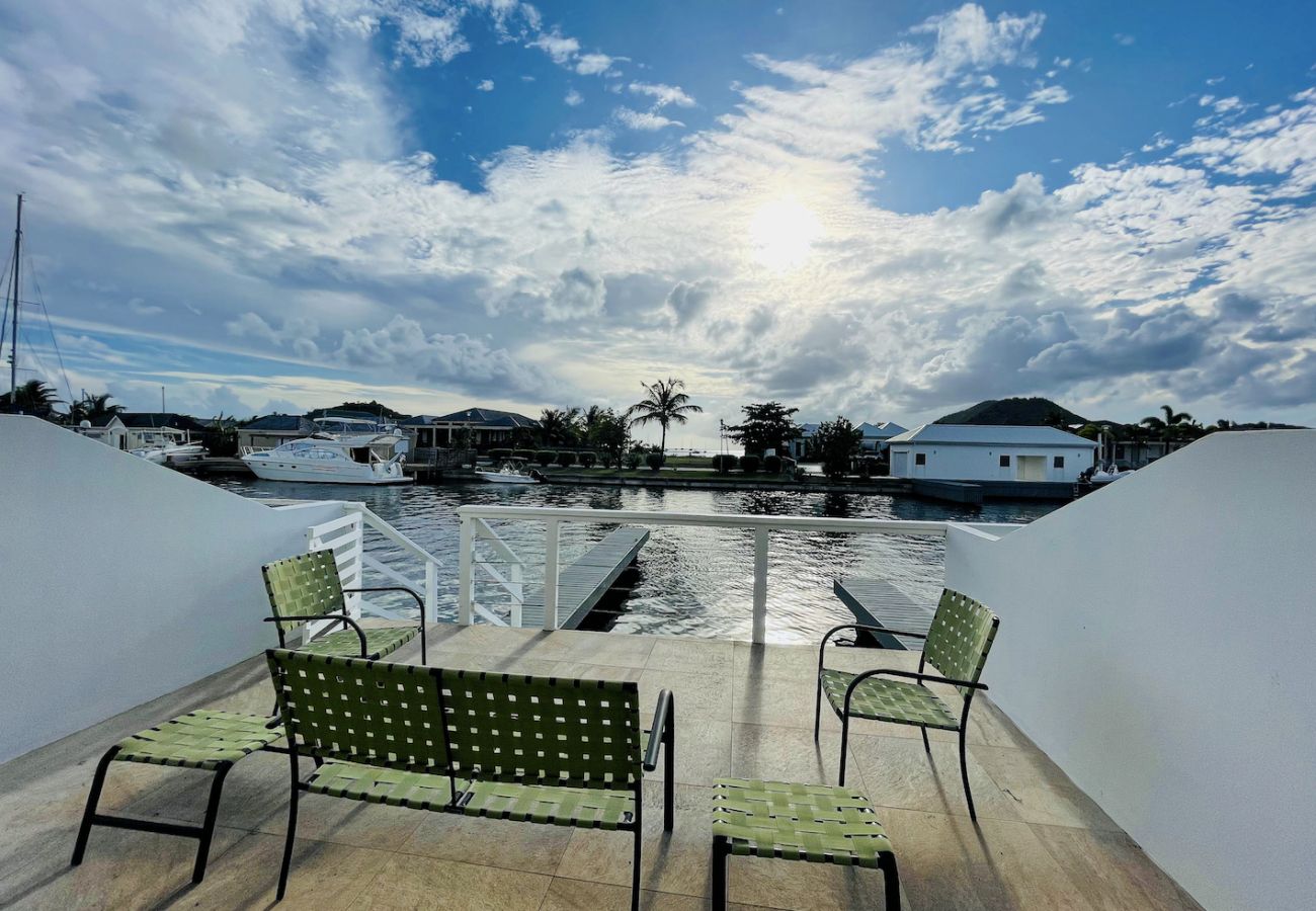 Stunning waterfront property with alfresco dining and sunset views at Jolly Harbour villa rentals 