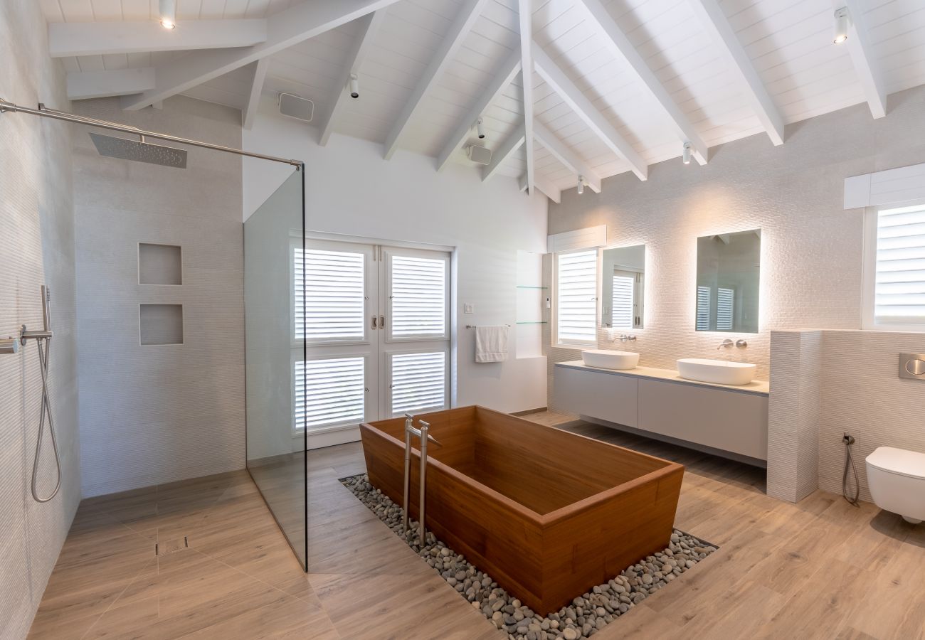 Beautiful ensuite bathroom with large double sink, japanese tub, private pool at Jolly Harbour Villa Rentals