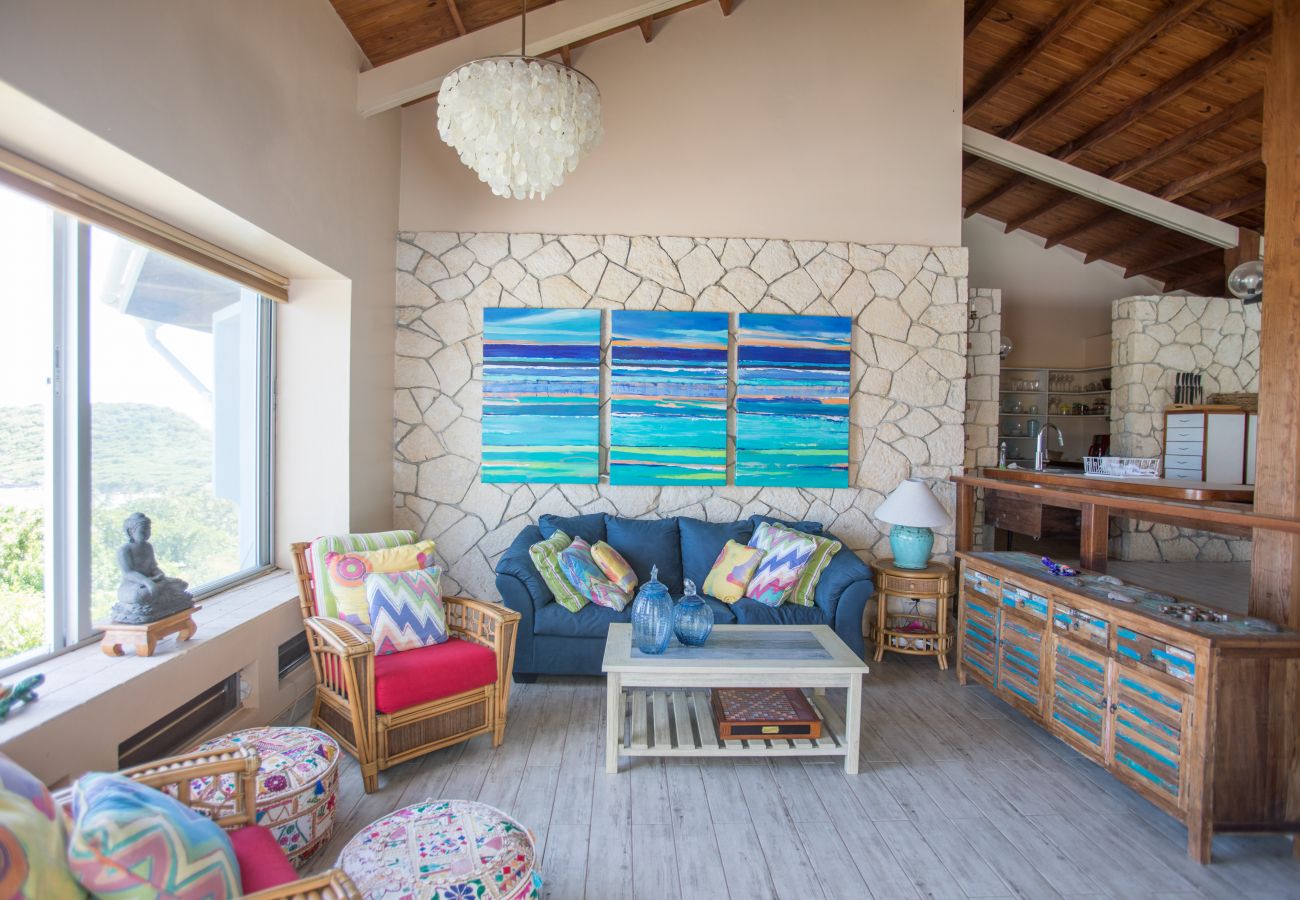 Internal living and dining areas with windows overlooking the rear garden at Half Moon Bay Villa rentals