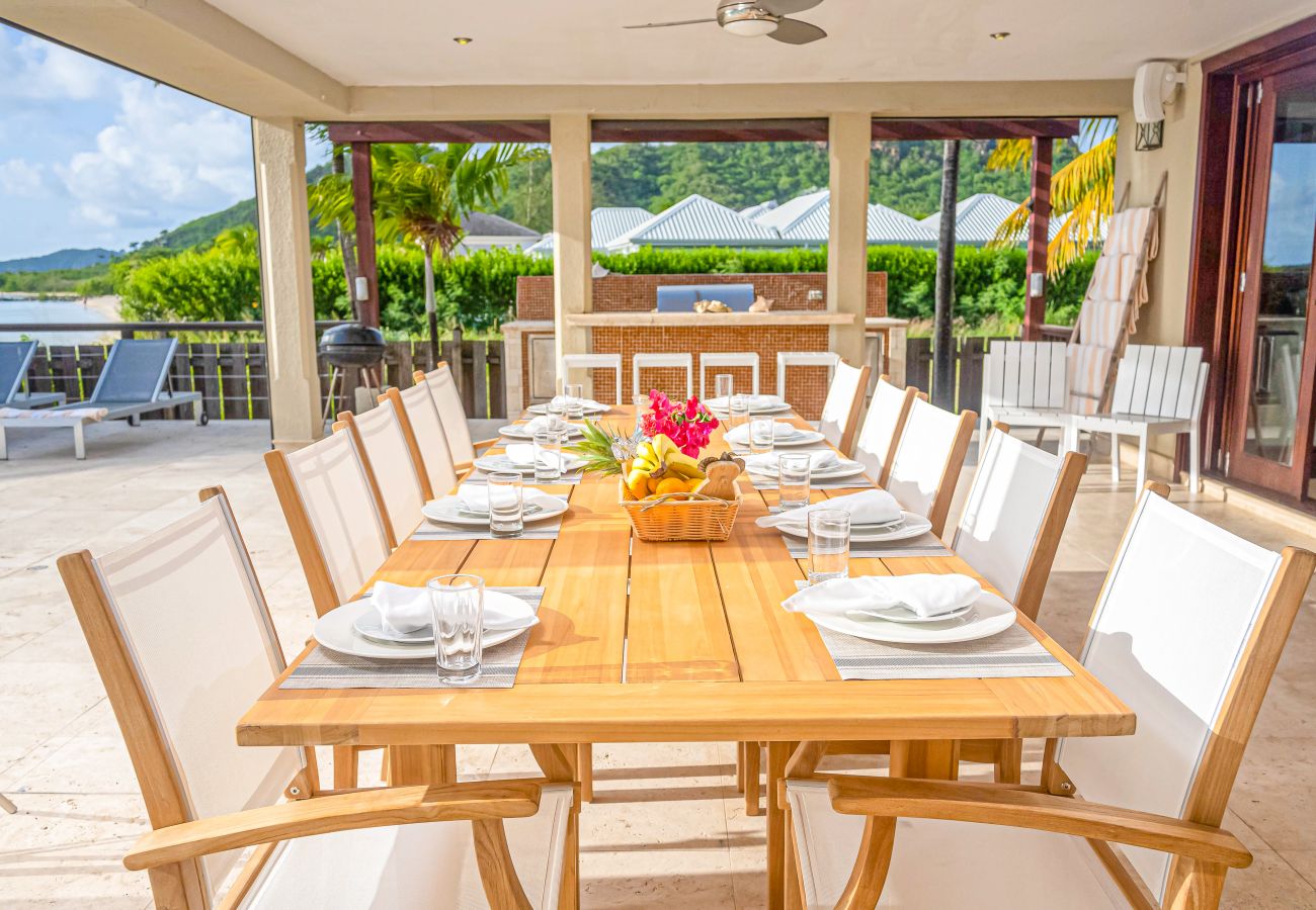 Alfresco dining, full barbeque suite, infinity pool private beach with amazing views at Jolly Harbour Villa rentals 