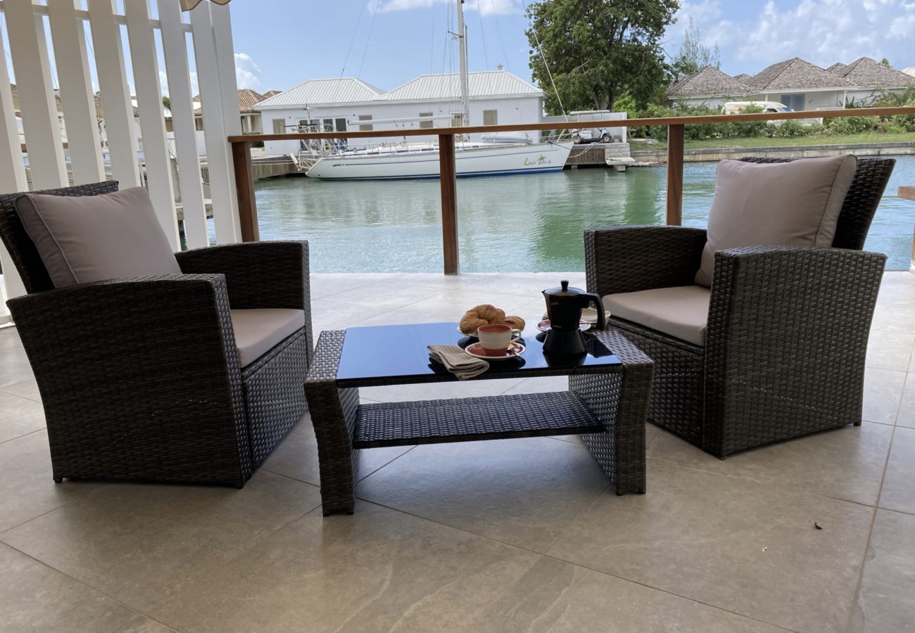 Jolly Harbour Villa rentals, private balcony, outdoor dining, waterfront views, covered terrace 
