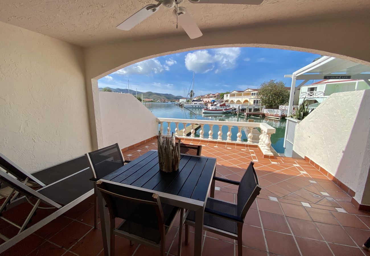 Jolly Harbour Villa rentals, Furnished terracotta patio, waterfront views with outdoor dining